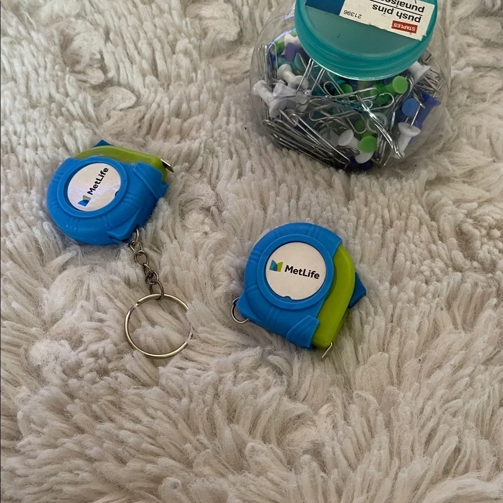 MetLife Blue and Green Tape Measures x 2 with Push Pins and paper clips .